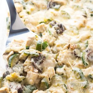 Low carb chicken zucchini casserole being scooped out of a dish