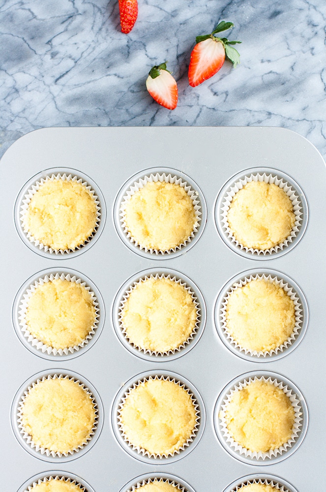 low carb coconut muffin batter scooped into muffin tins
