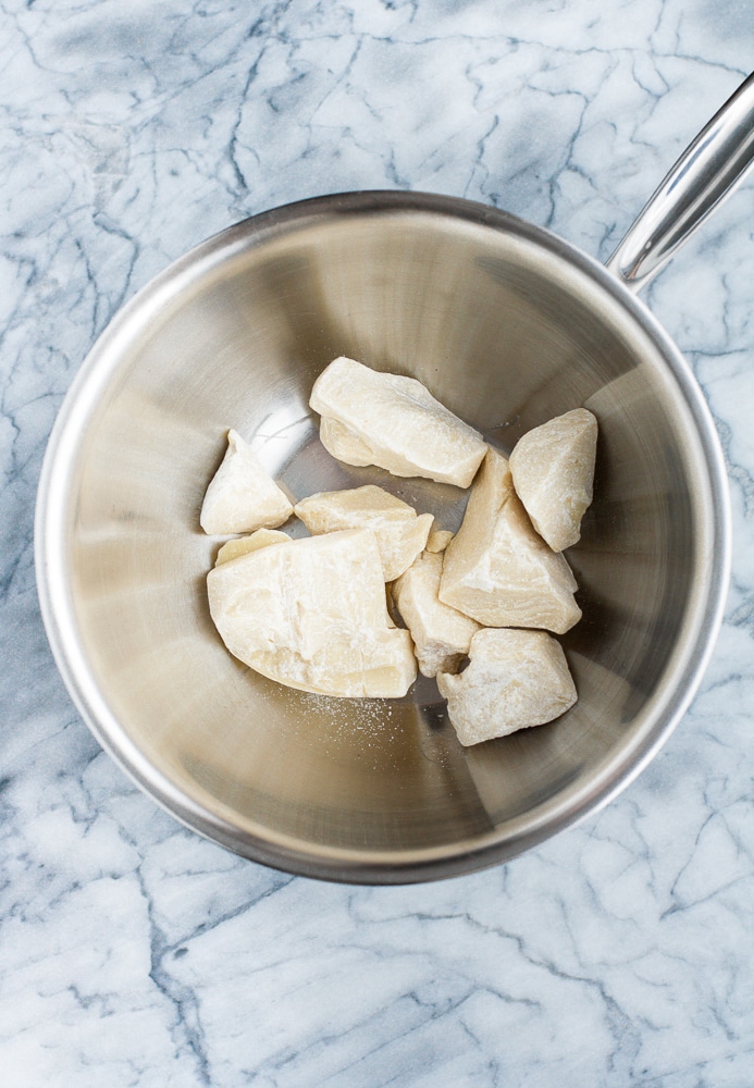 cocoa butter in a stainless steel bowl