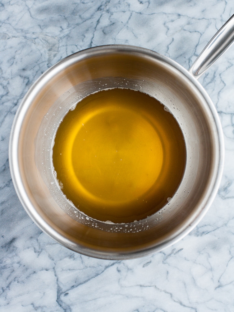 cocoa butter heated over medium-high heat in a separate saucepan until melted