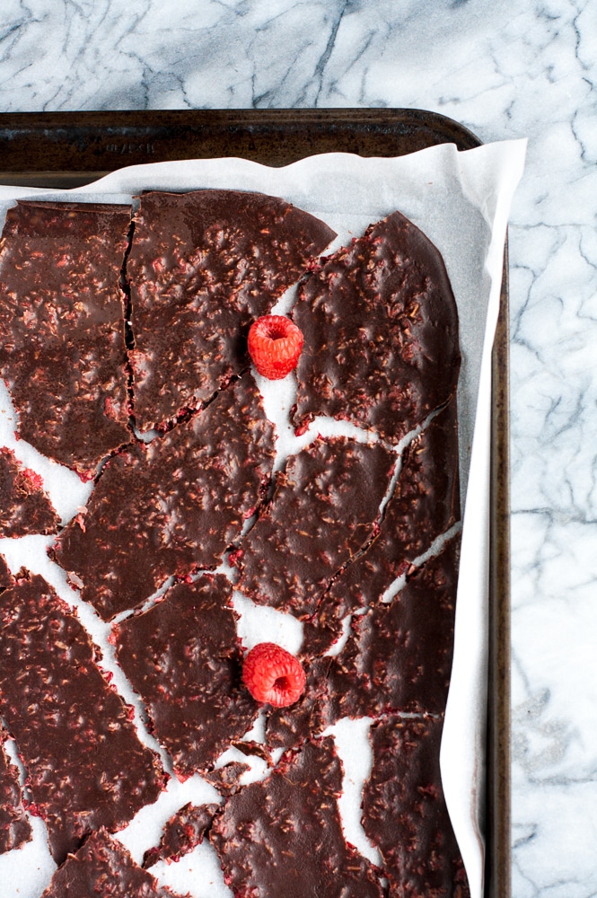 dark raspberry chocolate bark broken into desired size on a baking sheet lined with parchment paper