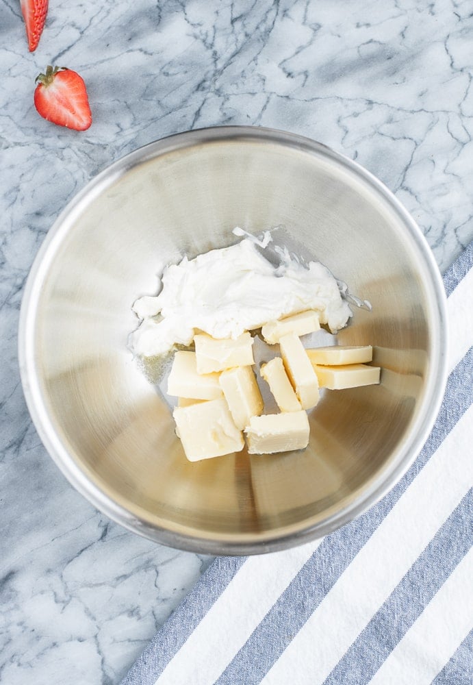 butter and cream cheese in a stainless steel mixing bowl
