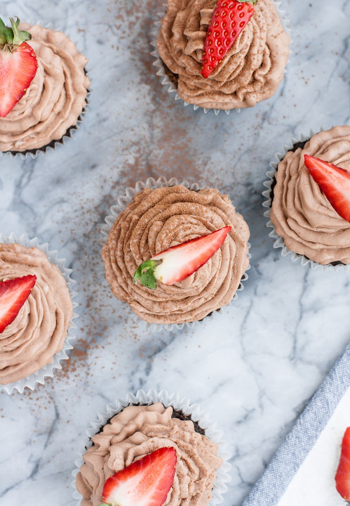 Low Carb Chocolate Strawberry Cupcakes spread atop a marble kitchen counter