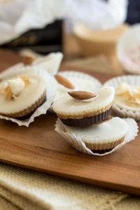 Keto Choconut Almond Butter Cups on a wooden cheeseboard