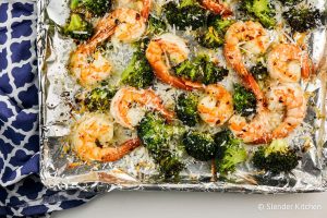 Garlic Parmesan Roasted Shrimp and Broccoli on a baking pan