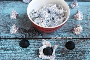 Chocolate Kisses Molded Candy in a small red bowl