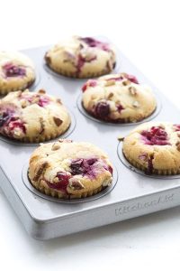 low carb cranberry sour cream blender muffins in a muffin tin