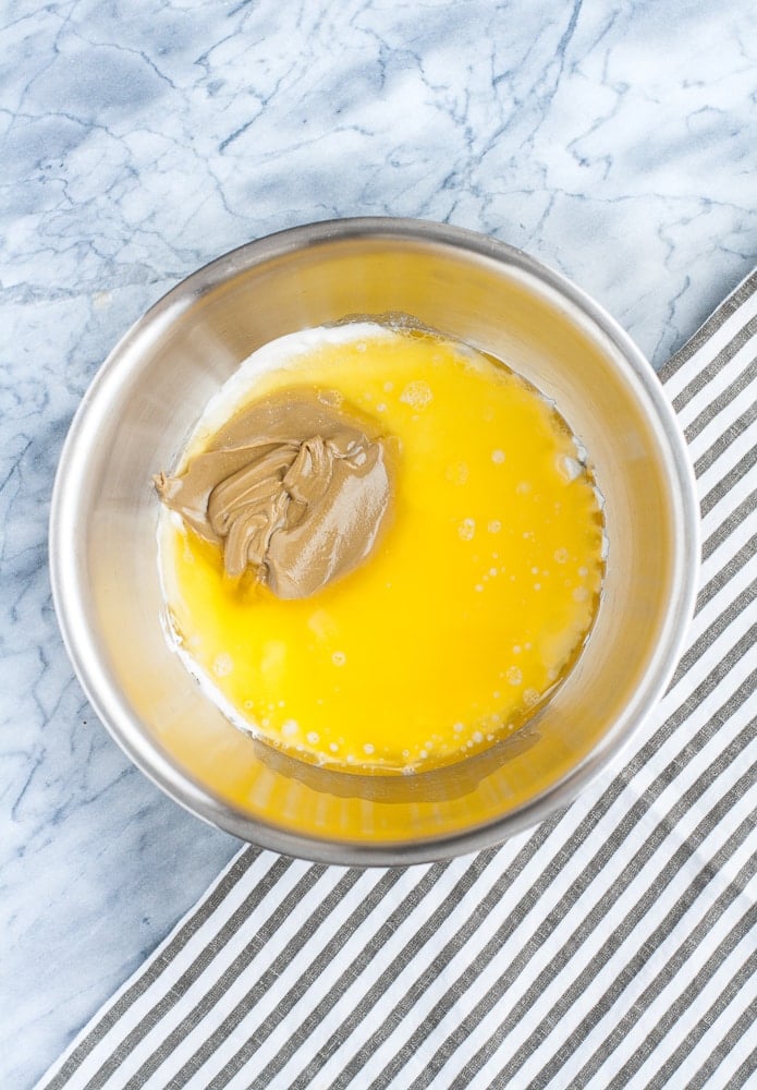 whipped cream cheese, melted butter, and SunButter in a mixing bowl