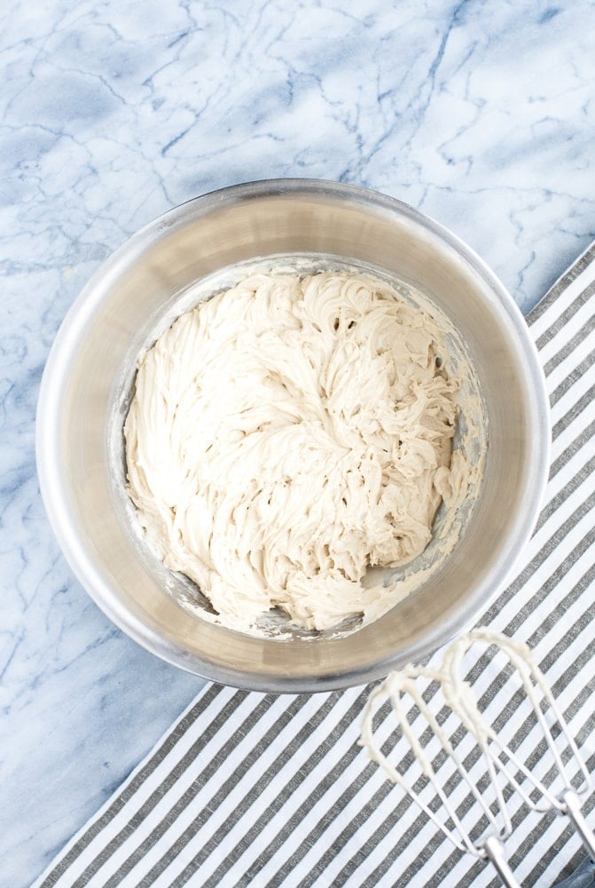 whipped cream cheese, melted butter, and SunButter in a mixing bowl whisked together using an electric mixer