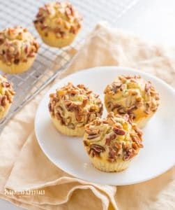 keto pecan pie muffins on a small plate and on a cooling rack