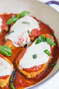 close-up of keto chicken parmesan topped with basil
