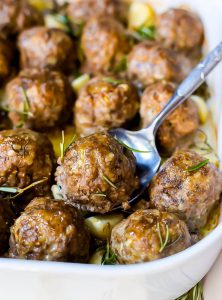 garlic rosemary whole 30 meatballs on a bowl with a spoon