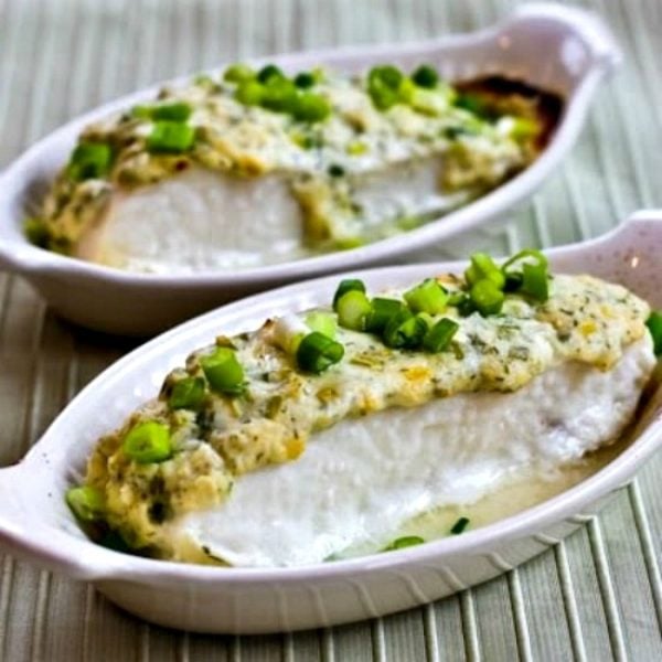 two servings of baked halibut in small baking dishes