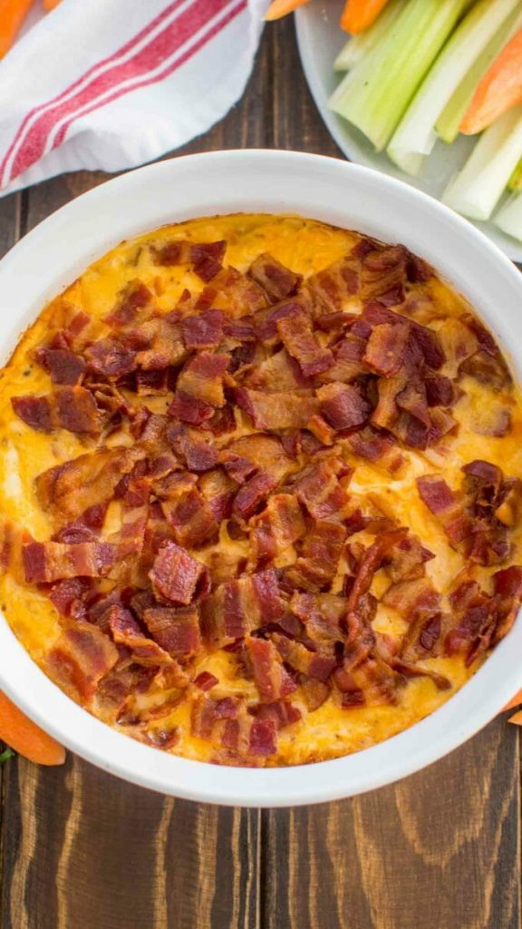 buffalo crack chicken dip in a circle casserole dish