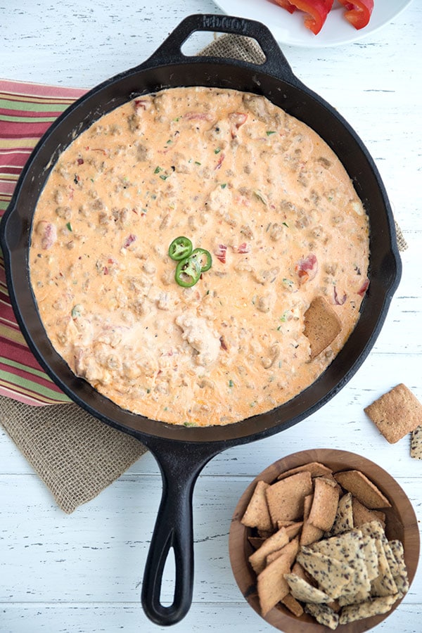 cast iron skillet with cheesy sausage dip