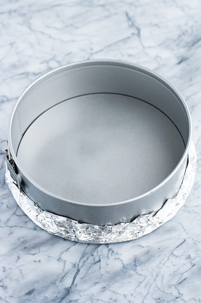 9-inch springform pan sprayed with nonstick cooking spray with bottom wrapped with aluminum foil