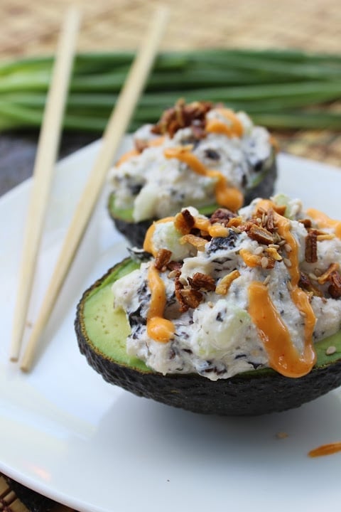 2 avocado halves stuffed with california roll fillings