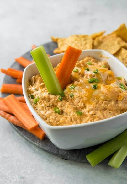 keto buffalo chicken dip with carrot stick and celery