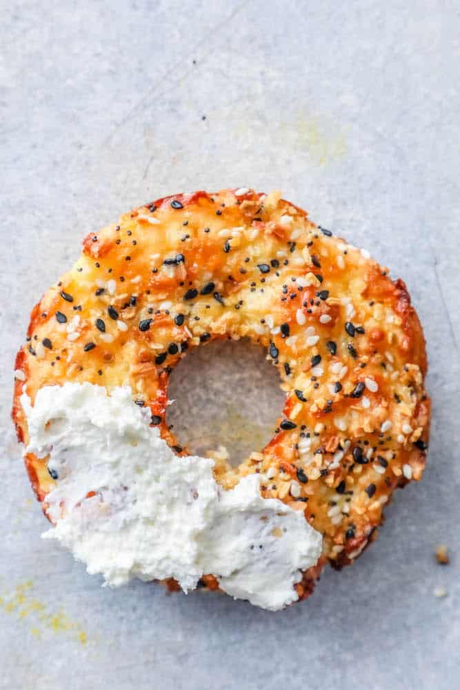 one keto low carb everything bagel with a smear of cream cheese