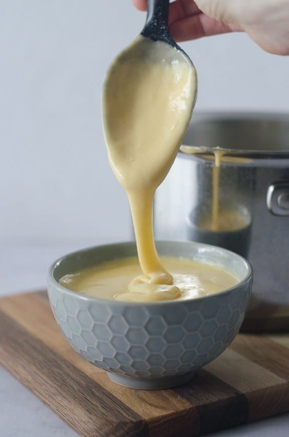 low carb queso oozing from a spoon