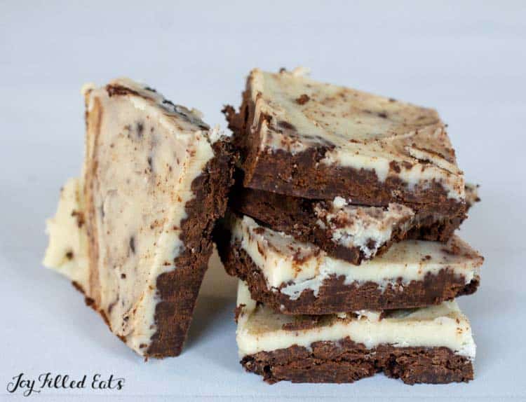 stacked peppermint cookies and cream bars with one leaning on the stack