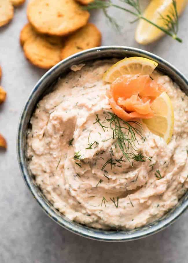 smoked salmon dip topped with dill and lemon slice