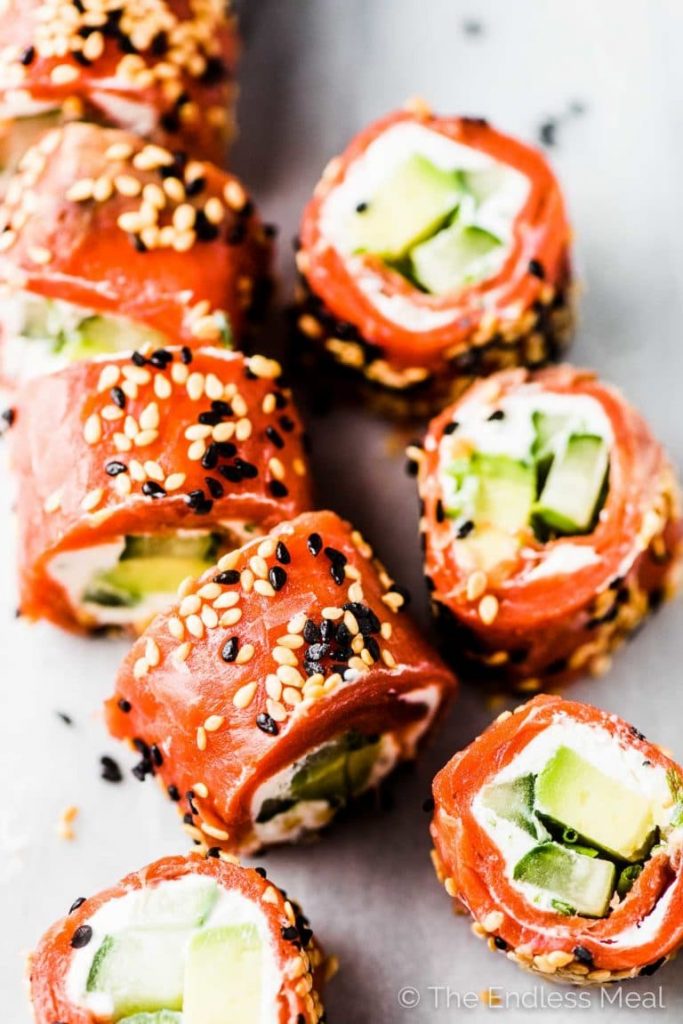 tzatziki salmon rolls sliced and covered in sesame seeds