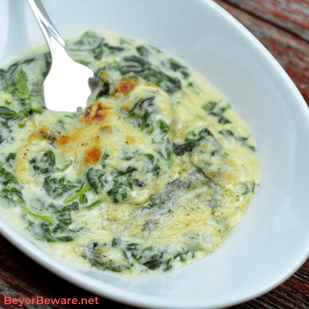 bowl of keto creamed spinach with fork