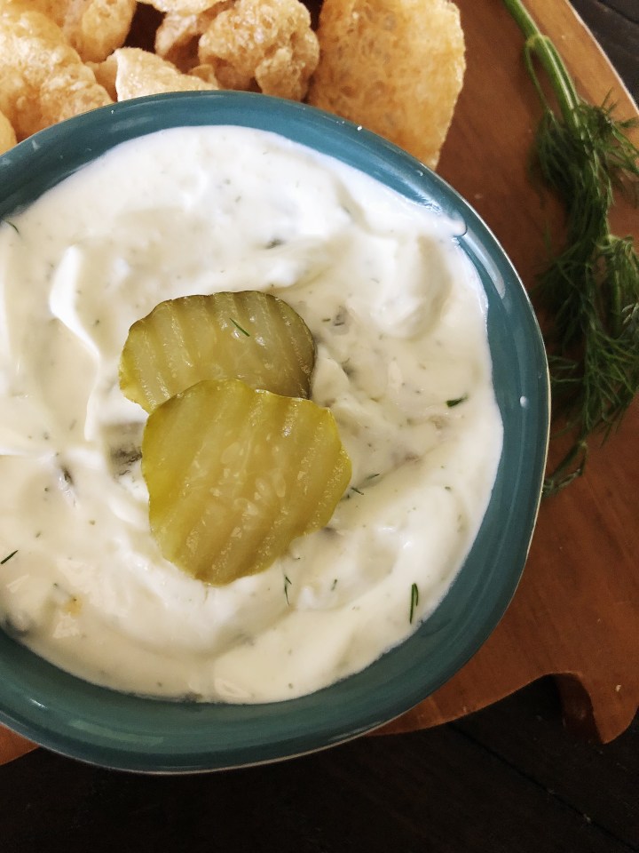 dill pickle dip topped with pickle coins