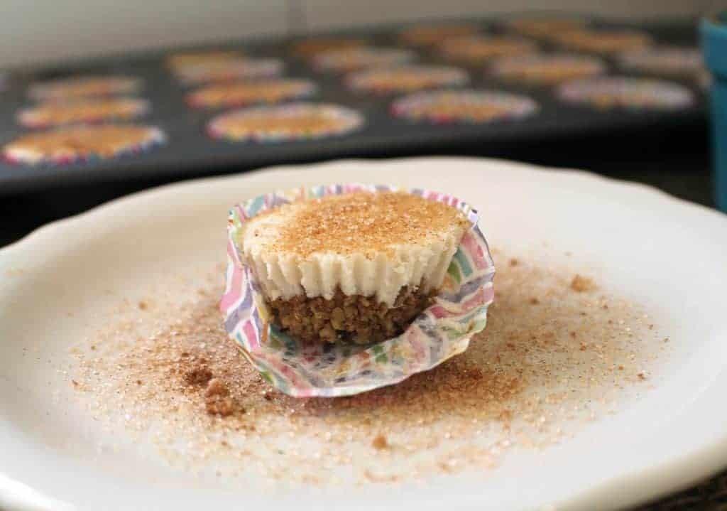 keto cheesecake bite with cupcake wrapper on a white plate