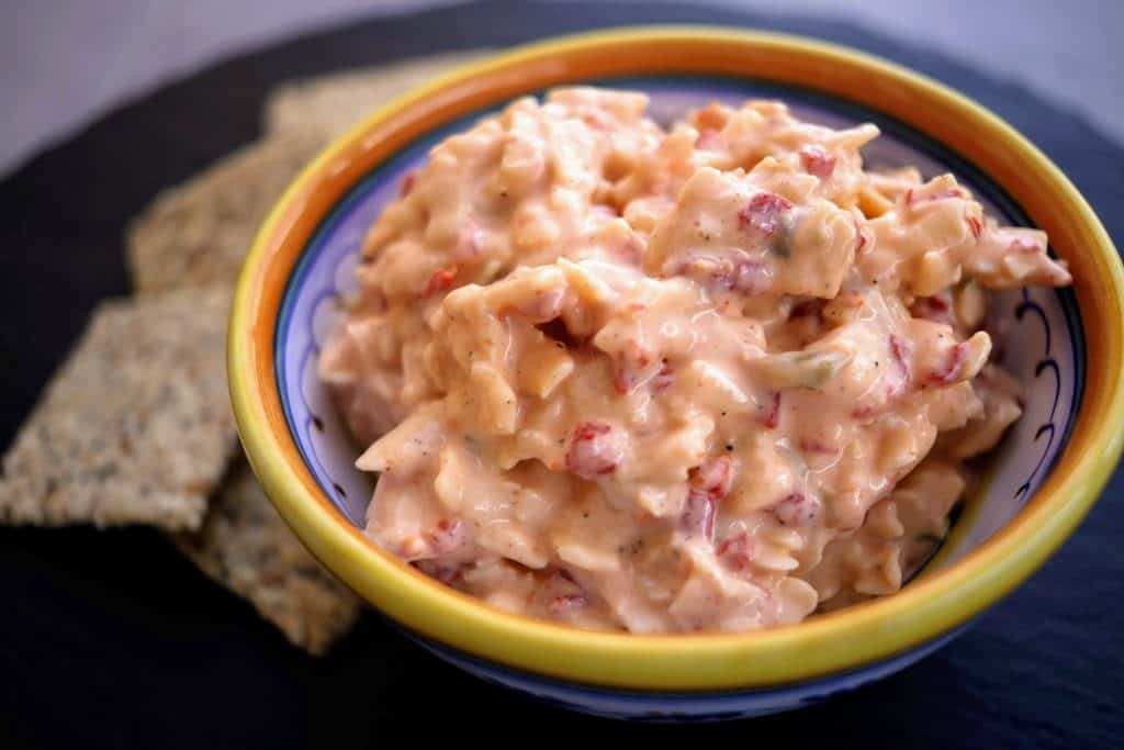 bowl of pimento cheese surrounded by low-carb crackers