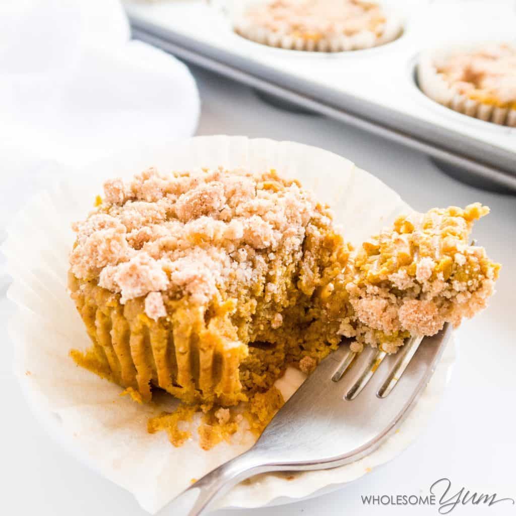 pumpkin pie cupcake with crumble topping with a bite taken out on a fork