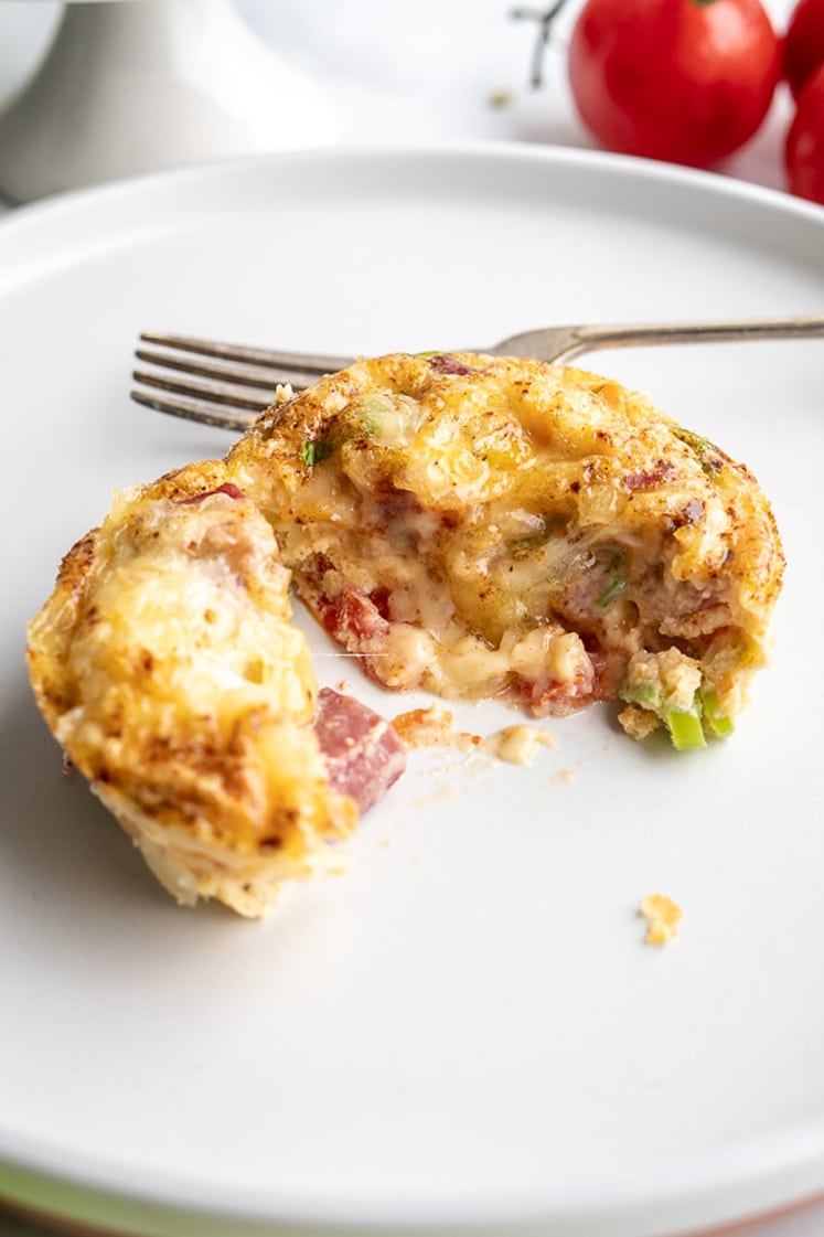 half eaten baked keto breakfast muffins on a plate with a fork
