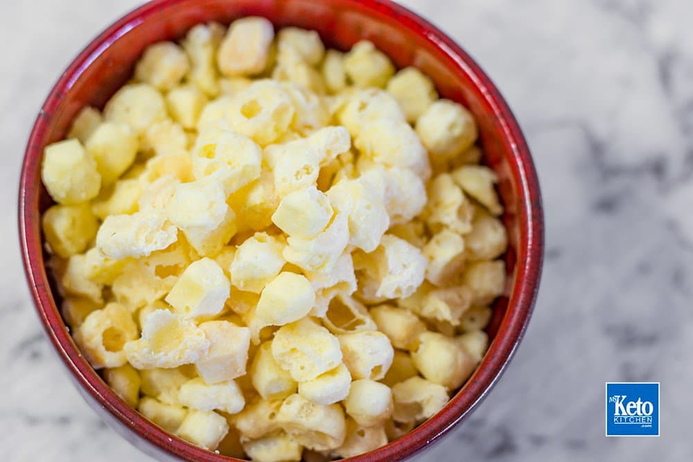 red bowl of keto popcorn cheese puffs