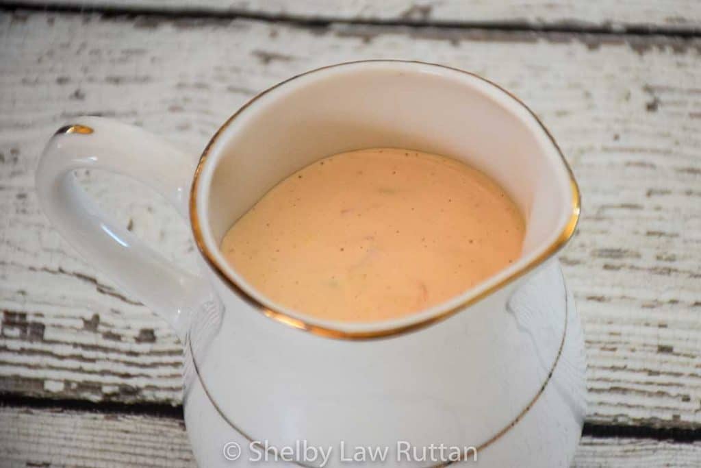 low carb thousand island dressing in a white and gold pouring container