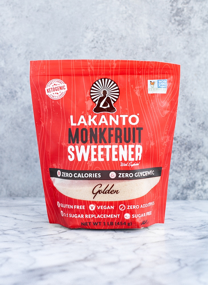 a bag of lakanto golden monk fruit sweetener atop a marble kitchen counter