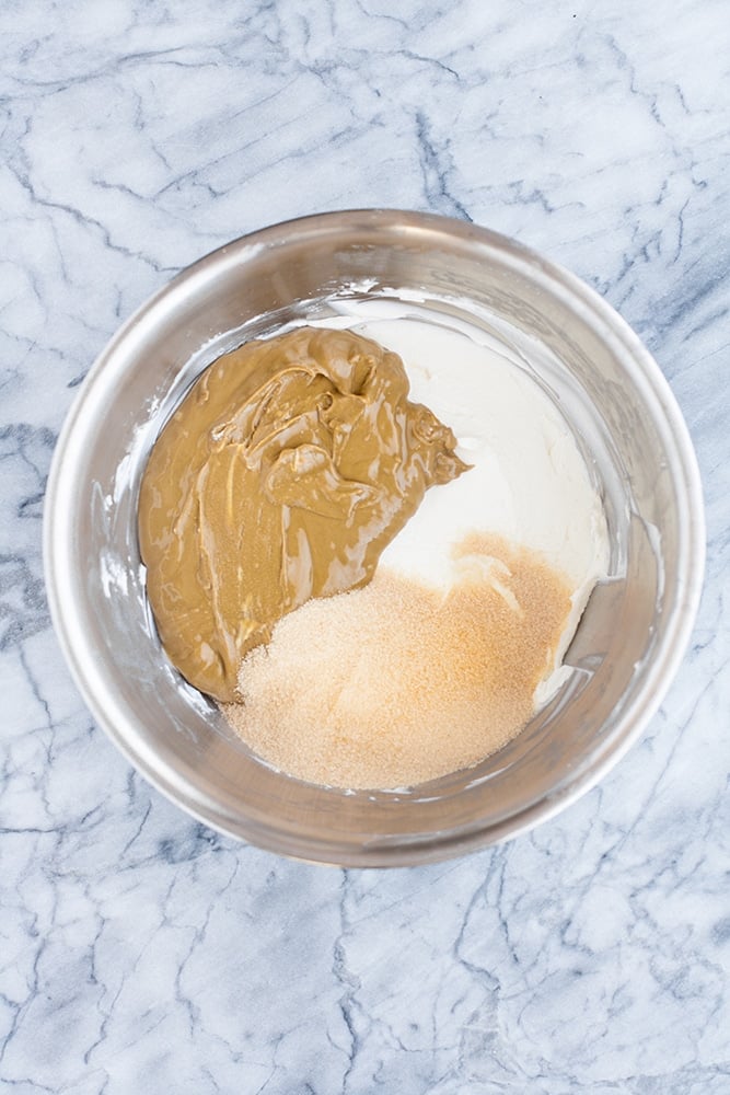 whisked cream cheese, sunbutter and monk fruit sweetener in a stainless steel mixing bowl