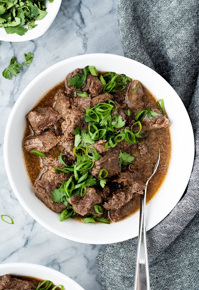 overhead shot of Keto Korean Barbecue Beef Freezer Meal garnished with green onions and cilantro