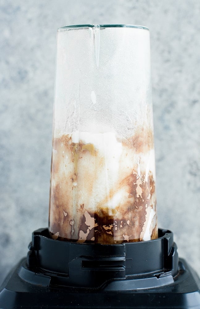 Chocolate Fat Bomb Smoothie ingredients poured into a blender and pulse mixed