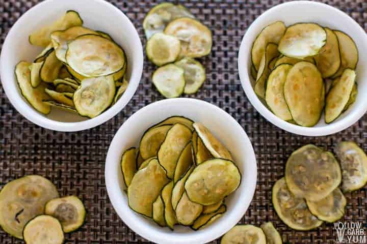 oven baked zucchini chips divided into 3 bowls