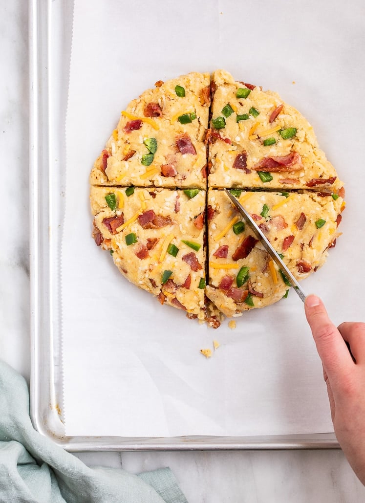 Low-Carb Bacon Cheddar Jalapeño Scone dough rolled to a circle and flattened before cut with a knife