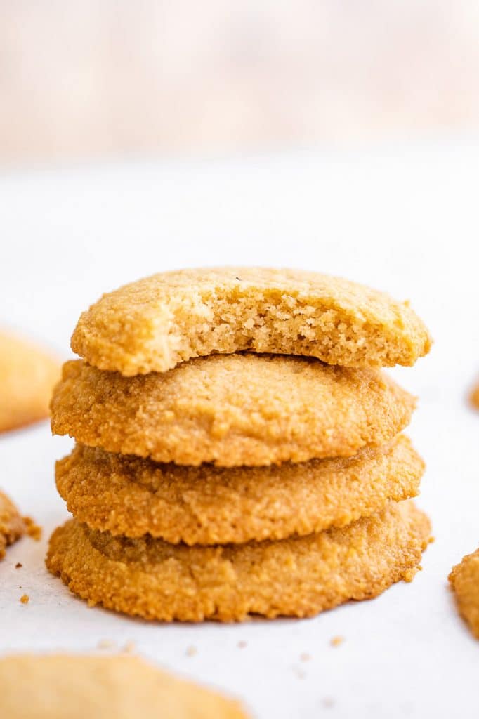 a stack of low carb cookies with one bitten through