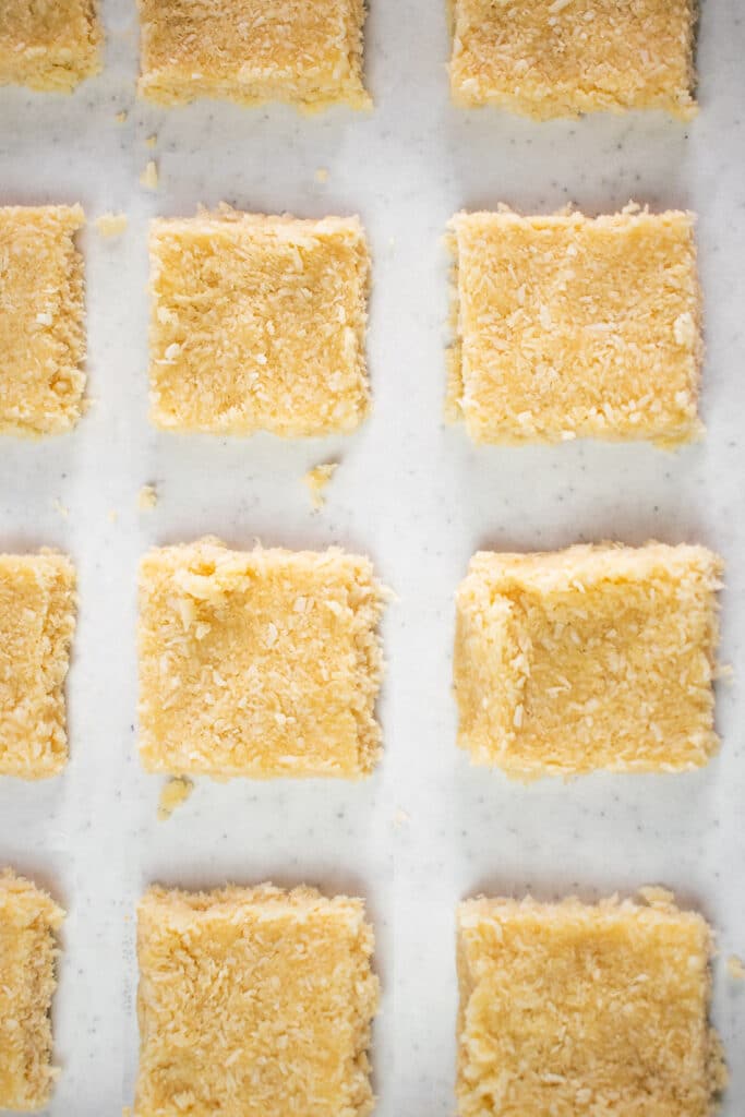 Low Carb Chocolate & Vanilla Glazed Coconut Bars cut into squares