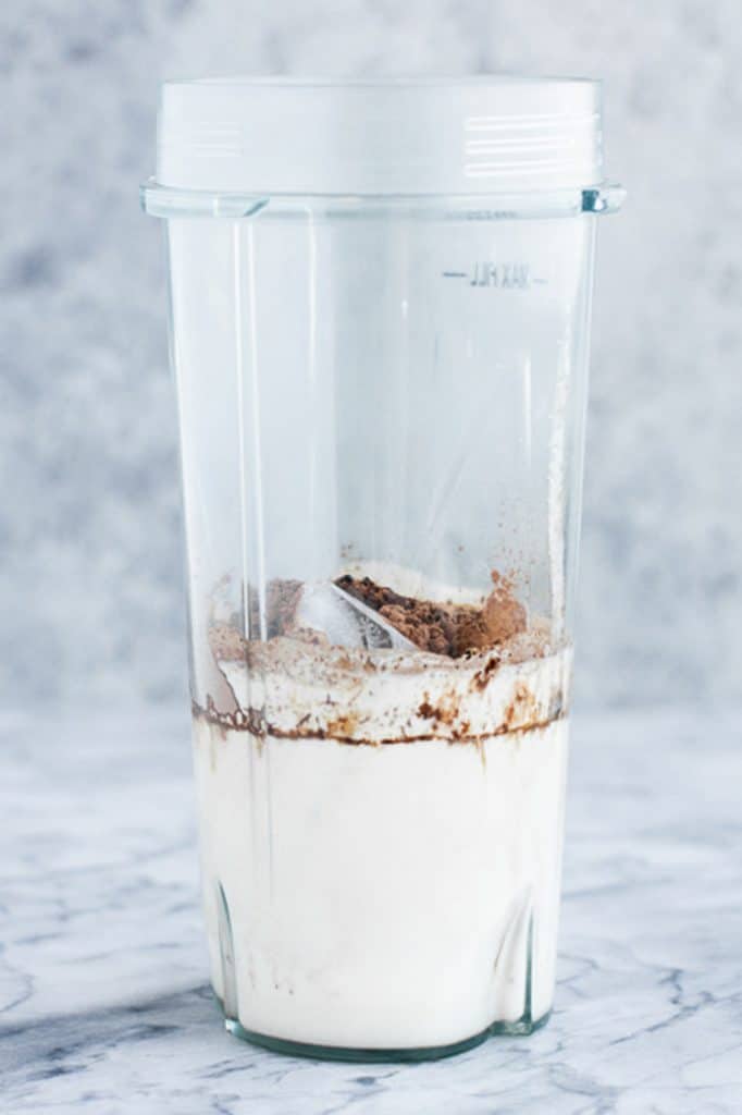 keto mocha smoothie ingredients in a high speed blender cup