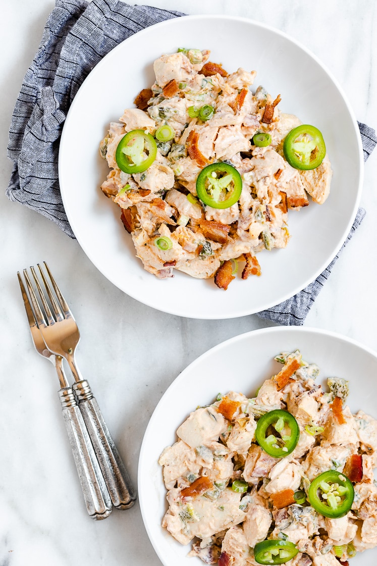 Jalapeño Popper Chicken Salad served on a plate beside fork atop a marble kitchen counter