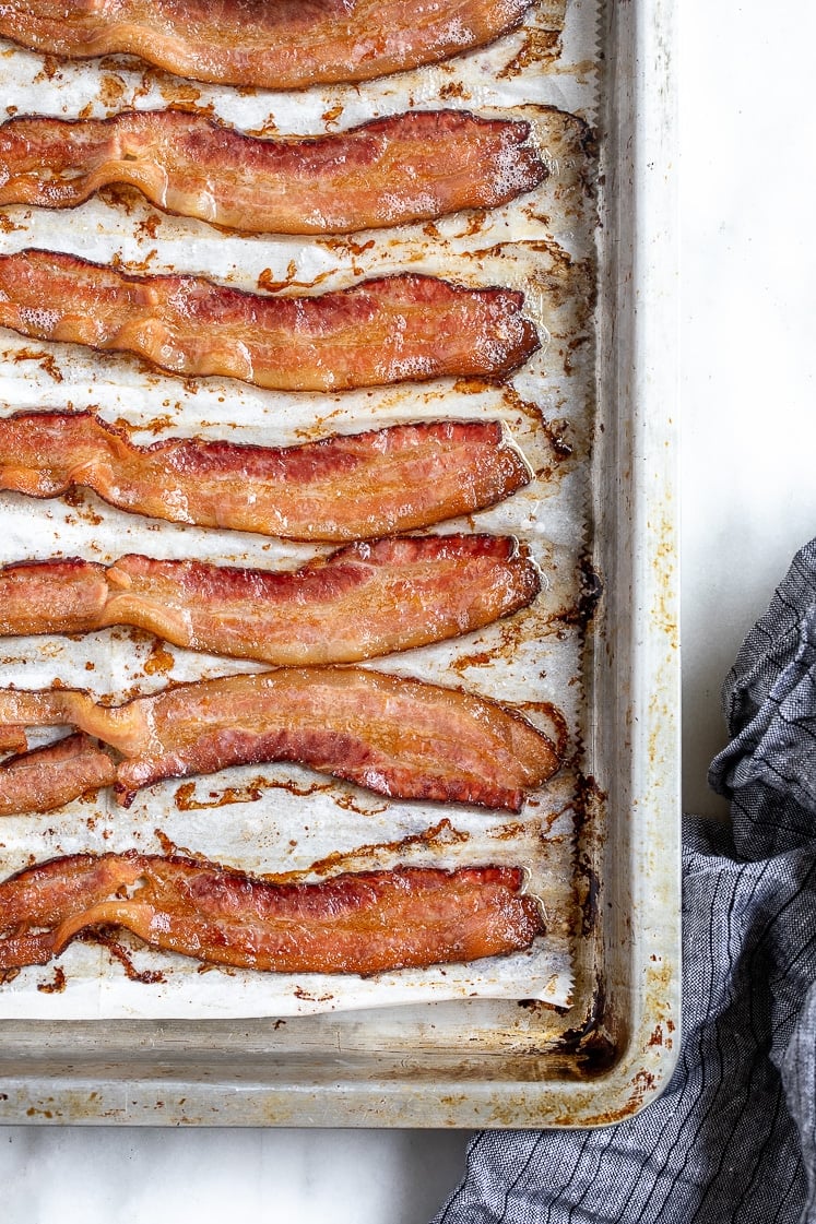 baked bacon strips on a baking tray