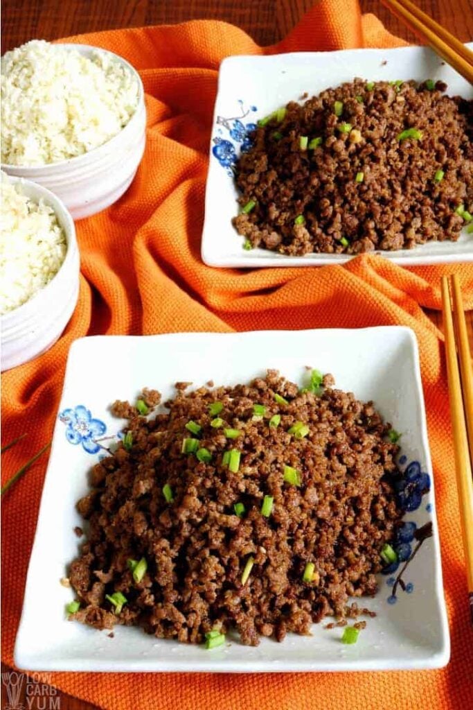 2 paleo korean ground beef on a plate with 2 rice bowls on the side by Low Carb Yum