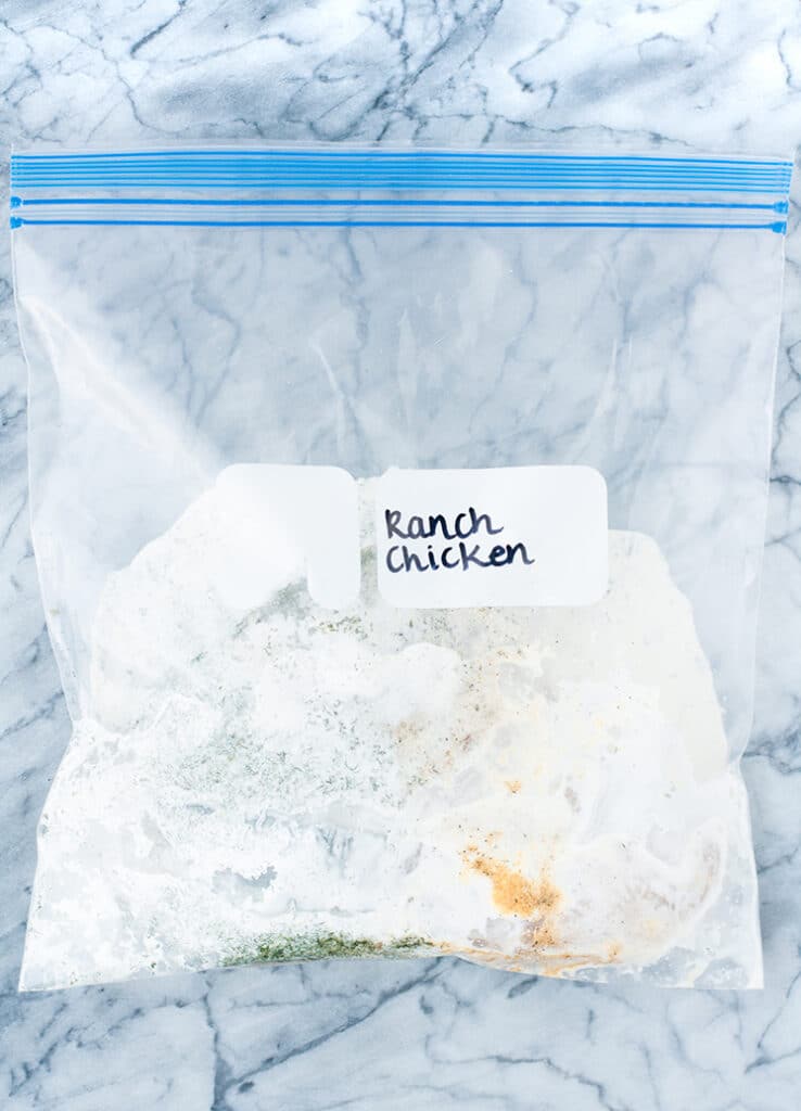 ranch chicken in a zip-lock bag atop a marble table