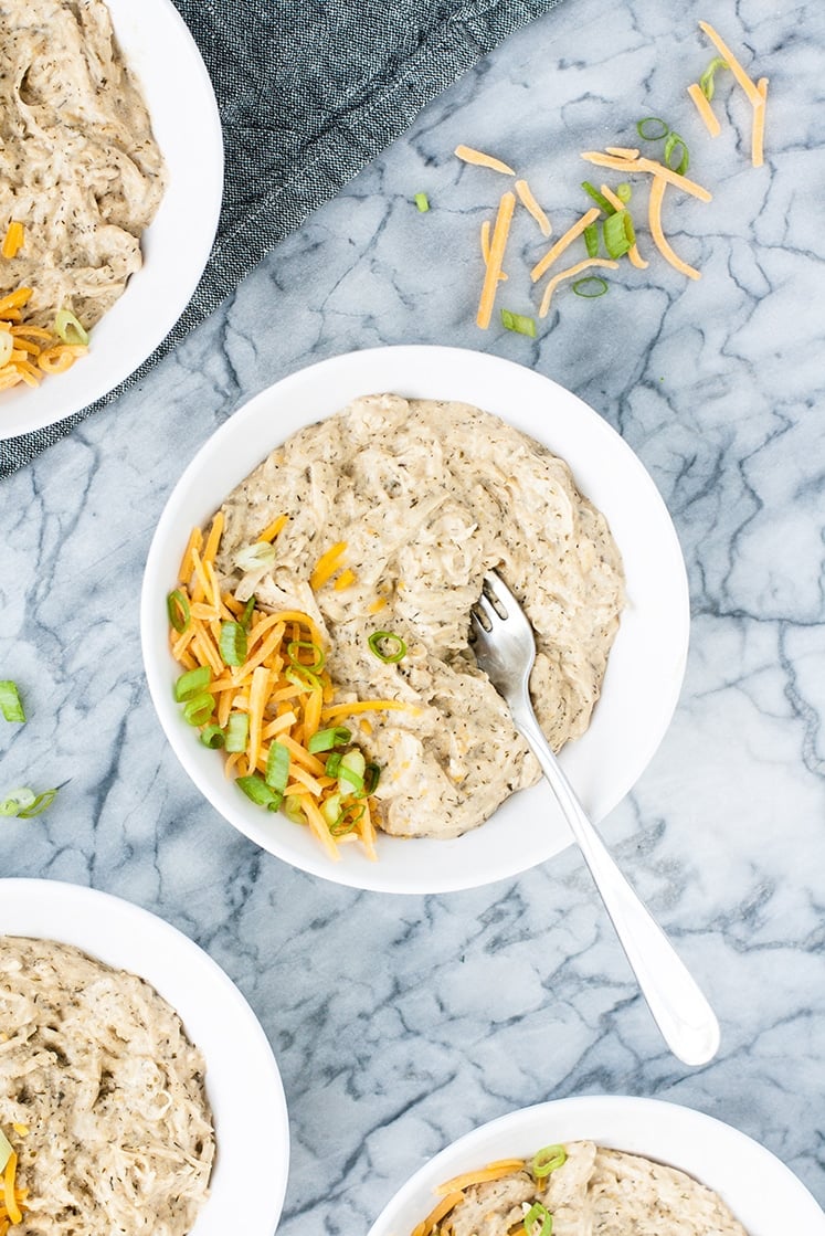 over head shot of Keto Creamy Ranch Chicken Freezer Meal in a bowl garnished with cheddar and green onions