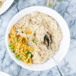 hero shot for Keto Creamy Ranch Chicken Freezer Meal in a bowl garnished with cheddar and green onions